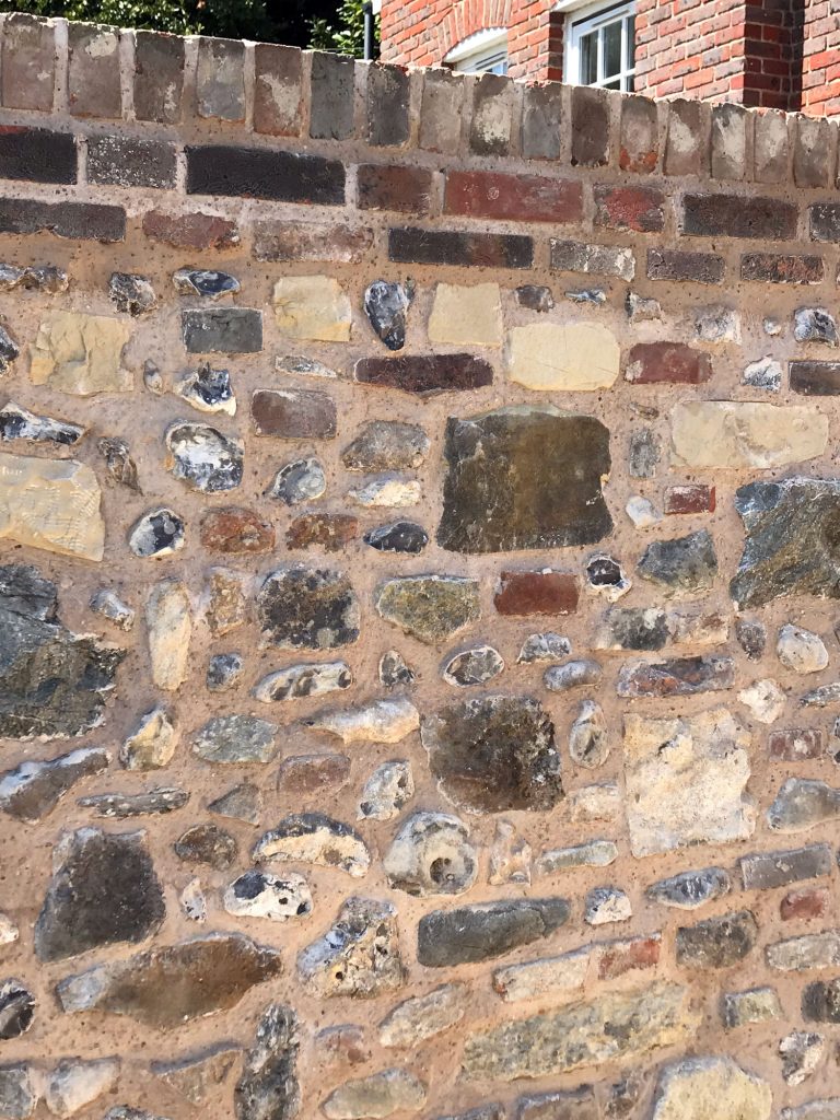 Close up of the completed flint stone wall - Professional Property Services